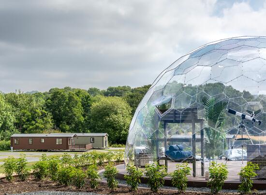 Luxury lodges and holiday homes for sale at Rockbridge Retreat, Wales. Photo of the Retreat and the stargazing dome