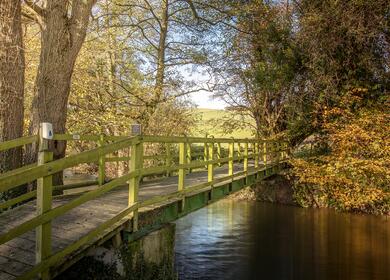 Luxury holiday lodges for sale in Wales at Rockbridge Park, Presteigne, Powys. - Bridge over the rive Lugg on park.