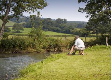 luxury holiday lodges with river fishing plots for sale in Wales - fishing photo