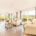 Luxury Cosgrove Lodge residential park home for sale in Wales. Lounge photo