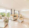 Luxury Cosgrove Lodge residential park home for sale in Wales. Lounge photo