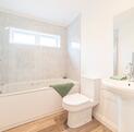 Luxury Cosgrove Lodge residential park home for sale in Wales. Main bathroom photo